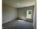 Comfortable bedroom featuring natural light, soft carpeting, and a serene atmosphere at 1000 Peedin Rd, Selma, NC 27576