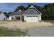 Charming new construction home with a two-car garage and beautiful architectural details at 1000 Peedin Rd, Selma, NC 27576