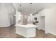 Kitchen with stainless steel appliances, white cabinets, stylish backsplash, quartz countertops and under cabinet lighting at 1000 Peedin Rd, Selma, NC 27576