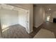 Bright, airy living space with hardwood floors, a ceiling with beams, and a door to the backyard at 1000 Peedin Rd, Selma, NC 27576