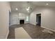 Spacious living room with high ceilings, a ceiling fan and a cozy fireplace, perfect for relaxing and entertaining at 1000 Peedin Rd, Selma, NC 27576