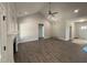 Open-concept living room with vaulted ceilings, hardwood floors, and a cozy fireplace at 1000 Peedin Rd, Selma, NC 27576