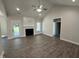 Cozy living room with vaulted ceiling, a fireplace, recessed lights, and beautiful flooring at 1000 Peedin Rd, Selma, NC 27576