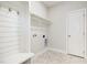 Mud room featuring a bench with coat hooks, storage, and a tiled floor at 1000 Peedin Rd, Selma, NC 27576