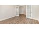 Spacious home office features luxury vinyl flooring, bright, natural light from French doors, and white trim at 1000 Peedin Rd, Selma, NC 27576