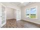 Home office boasts luxury vinyl flooring, French doors for privacy, bright window with field views, and ample room at 1000 Peedin Rd, Selma, NC 27576