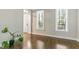 Open foyer with hardwood flooring and natural light, providing a welcoming entrance to the home at 1013 Whitney Springs Ct, Holly Springs, NC 27540