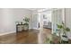 Bright foyer with hardwood floors and natural light, creating a welcoming entrance to the home's living spaces at 1013 Whitney Springs Ct, Holly Springs, NC 27540