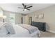 A serene main bedroom with closet and dresser at 1013 Whitney Springs Ct, Holly Springs, NC 27540