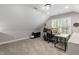 Finished attic featuring carpet, natural lighting, a work station, and space that is suitable for an office at 1013 Whitney Springs Ct, Holly Springs, NC 27540