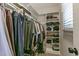 This walk-in closet has ample storage space and custom shelving at 1013 Whitney Springs Ct, Holly Springs, NC 27540