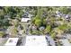 Aerial view of a residential neighborhood with tree-lined streets and proximity to local amenities and businesses at 104 E Wilson St, Mebane, NC 27302