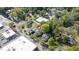 This aerial view highlights a tree-filled residential area with a mix of charming homes and nearby amenities at 104 E Wilson St, Mebane, NC 27302