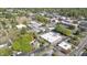 Aerial view of property surrounded by lush greenery in a bustling city neighborhood at 104 E Wilson St, Mebane, NC 27302