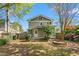 Backyard with shed, green lawn, and view of back of the house with deck at 104 E Wilson St, Mebane, NC 27302