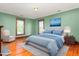 Bedroom with furniture, hardwood floors, and natural light at 104 E Wilson St, Mebane, NC 27302