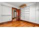 Walk-in closet with multiple shelving units at 104 E Wilson St, Mebane, NC 27302