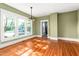 Inviting dining room with decorative lighting, a large window, and hardwood flooring at 104 E Wilson St, Mebane, NC 27302