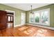 Charming dining room with decorative hanging lights and lots of sunshine coming through windows at 104 E Wilson St, Mebane, NC 27302