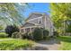 Charming two-story home with mature trees and landscaped yard at 104 E Wilson St, Mebane, NC 27302