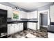 Functional kitchen with plenty of cabinets, stainless steel sink, and modern appliances at 104 E Wilson St, Mebane, NC 27302