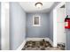 The laundry room has tile floors and a small window at 104 E Wilson St, Mebane, NC 27302