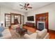 Inviting living room with hardwood floors, fireplace, and plush seating at 104 E Wilson St, Mebane, NC 27302