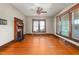 Bright living room with hardwood floors, detailed fireplace and plenty of light from windows at 104 E Wilson St, Mebane, NC 27302