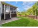Spacious backyard features a screened porch and lush green lawn at 1093 Trentini Ave, Wake Forest, NC 27587