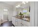 Bathroom featuring a granite countertop, large mirror, neutral paint, and walk-in shower at 1093 Trentini Ave, Wake Forest, NC 27587
