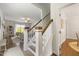 Inviting entryway showcasing a staircase with wooden accents and a view of the living room at 1093 Trentini Ave, Wake Forest, NC 27587