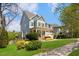 Charming two-story home with a beautifully landscaped front yard and inviting covered porch at 1093 Trentini Ave, Wake Forest, NC 27587