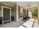 Inviting front porch with neutral paint and ceiling fan at 1093 Trentini Ave, Wake Forest, NC 27587