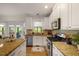 Kitchen area featuring stainless steel appliances, granite countertops, and an island at 1093 Trentini Ave, Wake Forest, NC 27587