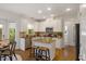 Kitchen featuring white cabinets, granite countertops, and stainless steel appliances at 1093 Trentini Ave, Wake Forest, NC 27587