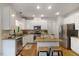 Well-lit kitchen featuring granite countertops and stainless steel appliances at 1093 Trentini Ave, Wake Forest, NC 27587