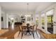 Eat-in kitchen area, showing an open layout to the living room and outside deck at 1093 Trentini Ave, Wake Forest, NC 27587
