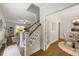 Open living space with hardwood floors, fireplace, and views to dining at 1093 Trentini Ave, Wake Forest, NC 27587