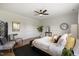 Bright main bedroom featuring neutral paint, ceiling fan, and ample natural light at 1093 Trentini Ave, Wake Forest, NC 27587