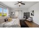 Main bedroom with ensuite bathroom, a ceiling fan, wooden floors, and many stylish design choices at 1093 Trentini Ave, Wake Forest, NC 27587