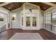 Spacious screened porch with wood ceiling, and natural light, leading to an outdoor space at 1093 Trentini Ave, Wake Forest, NC 27587