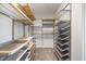 Spacious walk-in closet offers abundant storage with shelves, drawers, and hanging rods at 1093 Trentini Ave, Wake Forest, NC 27587