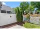 Well-maintained backyard featuring a privacy fence, green shrubs, and a neatly manicured lawn, perfect for outdoor enjoyment at 11210 Lofty Heights Pl, Raleigh, NC 27614