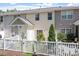 A well-kept backyard with a white picket fence and plenty of sunlight at 11210 Lofty Heights Pl, Raleigh, NC 27614