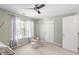 Well-lit bedroom featuring a large window, a closet, and ample space for playing at 11210 Lofty Heights Pl, Raleigh, NC 27614