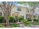 Charming townhome with stone accents and well-maintained landscaping under a blue sky at 11210 Lofty Heights Pl, Raleigh, NC 27614