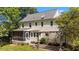 Charming home featuring a backyard with a screened porch and pergola-covered patio, perfect for outdoor relaxation and entertaining at 1140 Buttercup Ln, Wake Forest, NC 27587