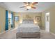 Bedroom with neutral walls, carpeted floors, a ceiling fan, and a large bed with white bedding at 1140 Buttercup Ln, Wake Forest, NC 27587