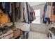 Organized closet with hanging clothes, shelves, and Patriot Pantry food storage, offering efficient storage solutions at 1140 Buttercup Ln, Wake Forest, NC 27587
