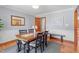 Traditional dining room with wood table, crown molding, and natural light at 1140 Buttercup Ln, Wake Forest, NC 27587